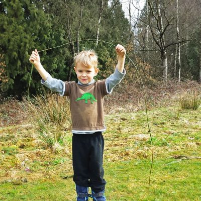 Big grass circle made from the grasses growing behind him in patches by sticking the spiky end into the woody end of another stalk.